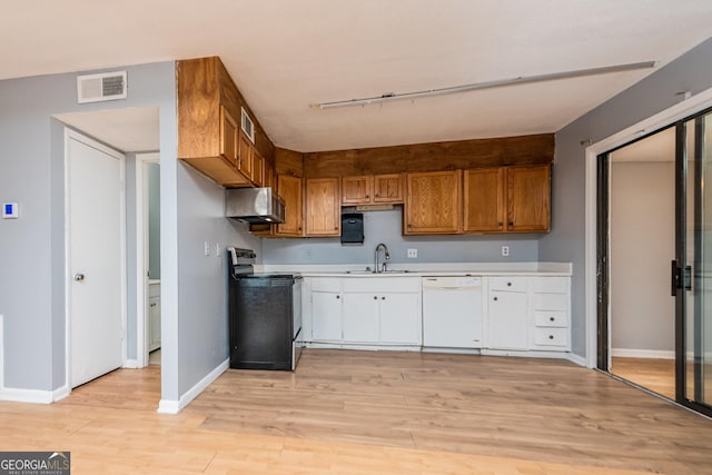 kitchen with range with electric cooktop, white dishwasher, light hardwood / wood-style floors, and sink