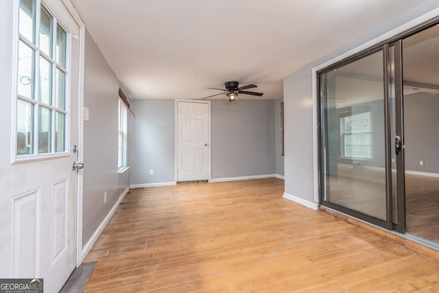 spare room featuring ceiling fan and light hardwood / wood-style flooring