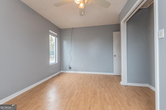 empty room with light hardwood / wood-style floors and ceiling fan