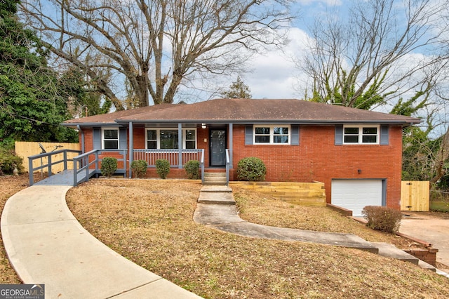 ranch-style home featuring a porch and a garage