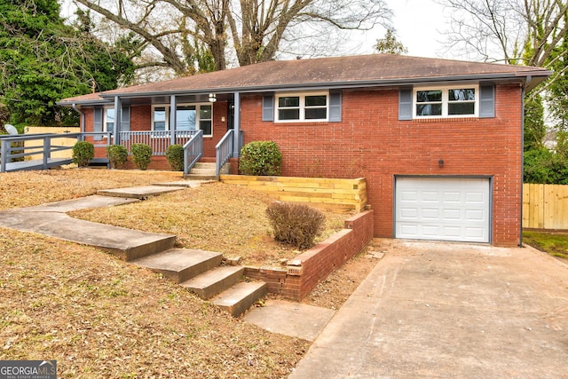 view of front of property with a garage and covered porch