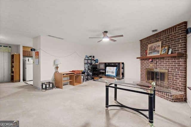 living room featuring ceiling fan, light carpet, and a brick fireplace