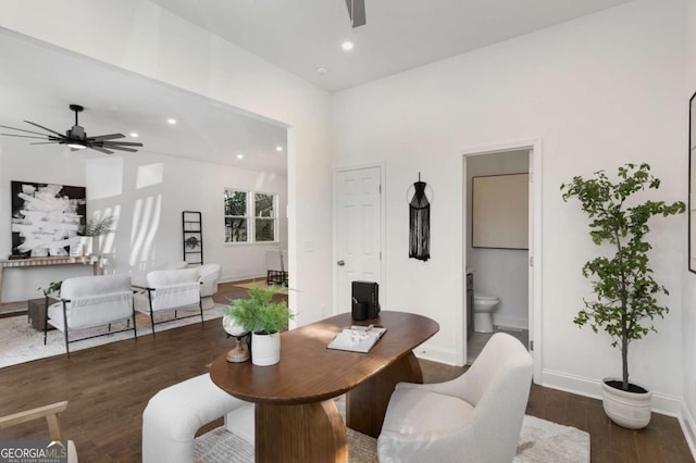 dining area featuring ceiling fan and dark hardwood / wood-style flooring