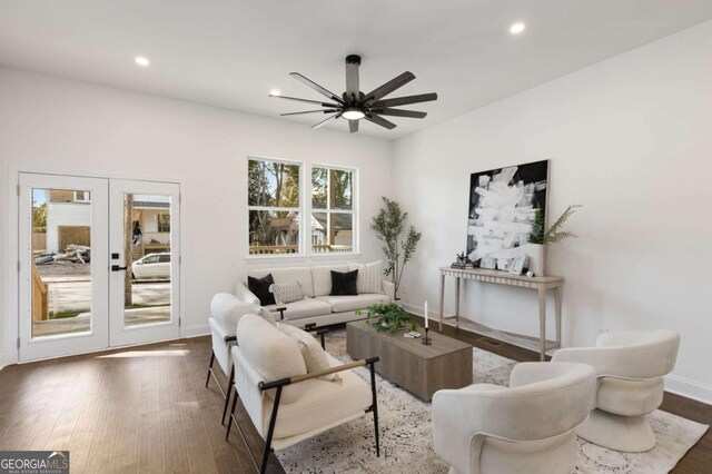 living room with ceiling fan, french doors, and dark hardwood / wood-style floors