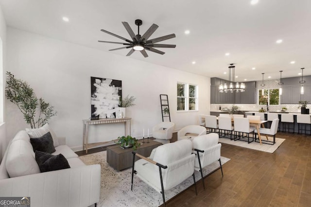 living room with ceiling fan and dark wood-type flooring