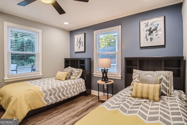 bedroom featuring wood-type flooring and ceiling fan