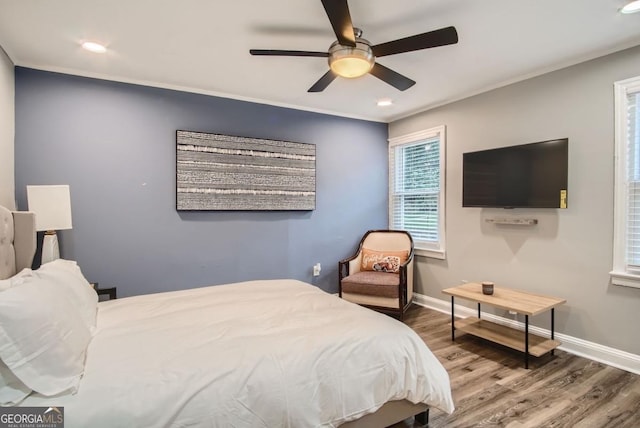 bedroom featuring wood-type flooring and ceiling fan