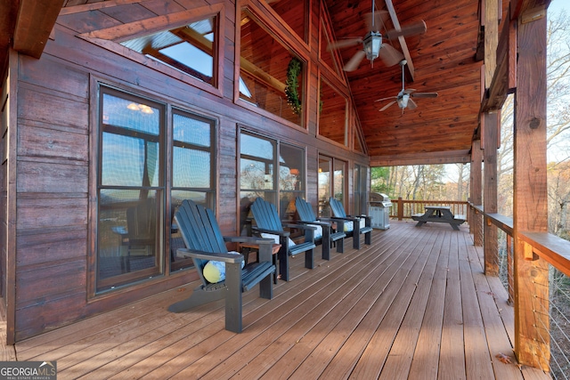 deck featuring a grill and ceiling fan