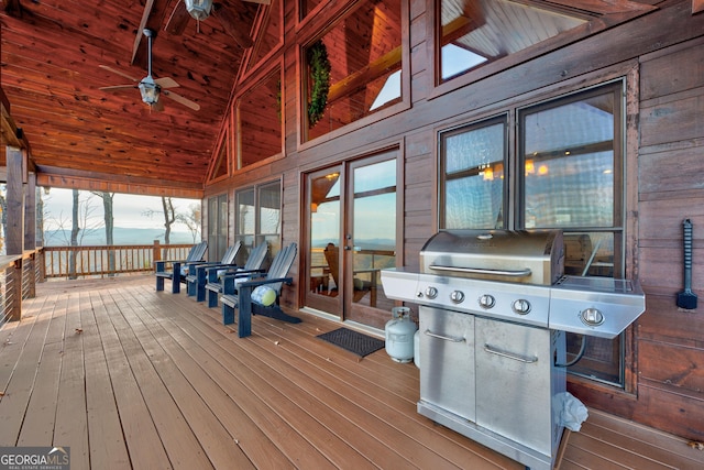 wooden deck with ceiling fan and grilling area