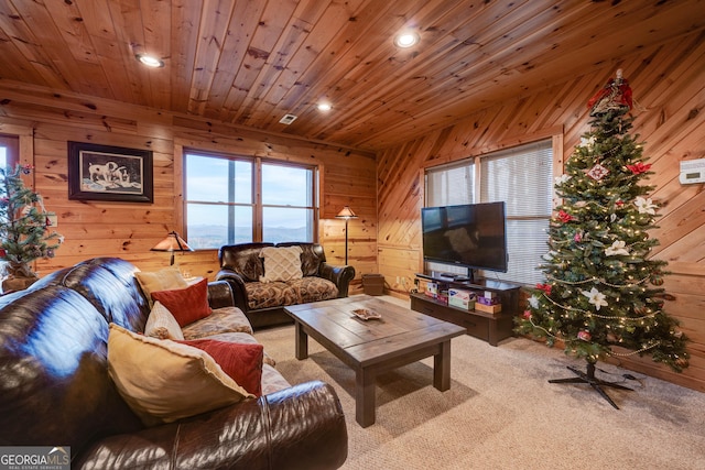 carpeted living room featuring wooden ceiling and wood walls