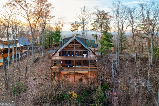 view of back house at dusk