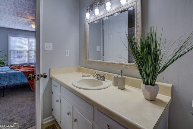 bathroom featuring vanity and ceiling fan