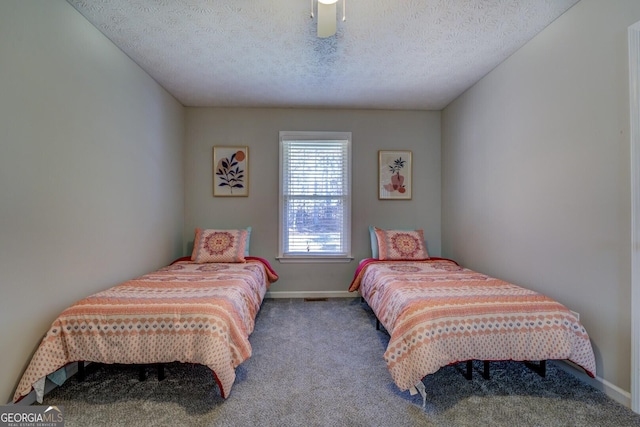 carpeted bedroom with a textured ceiling