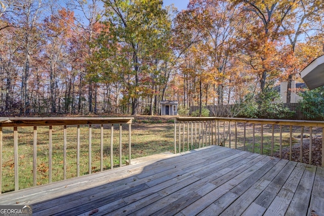 wooden deck featuring a yard