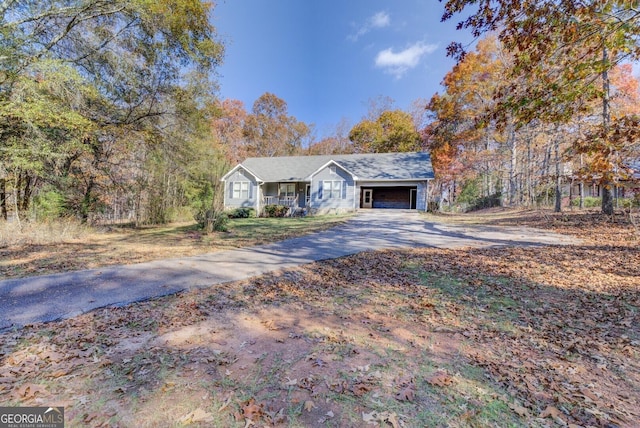 ranch-style home featuring a garage