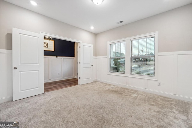 unfurnished bedroom featuring carpet flooring