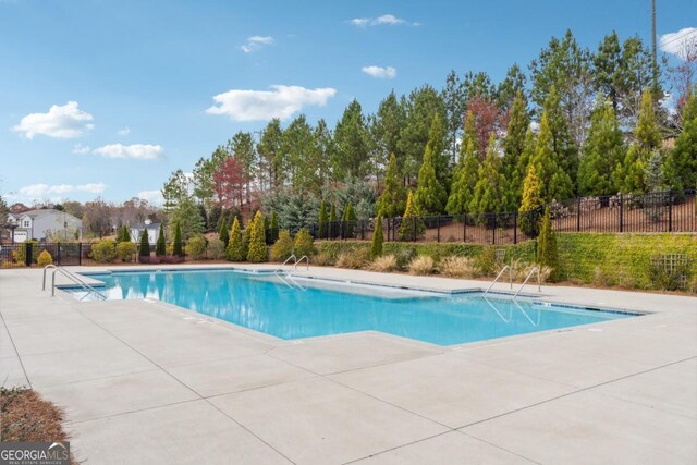 view of pool featuring a patio