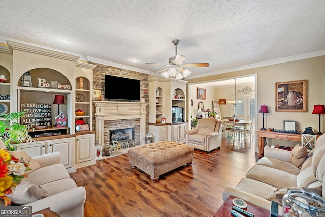 living room featuring a textured ceiling, crown molding, ceiling fan with notable chandelier, and hardwood / wood-style flooring