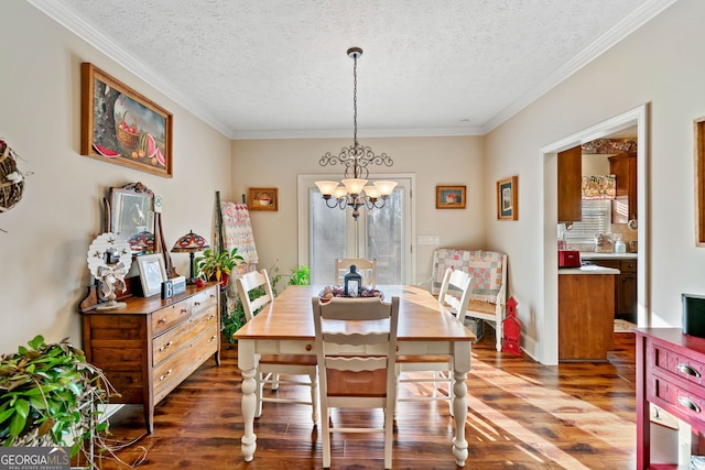 dining area with crown molding, dark hardwood / wood-style flooring, a chandelier, and a textured ceiling