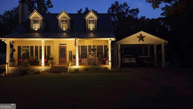 view of front facade featuring covered porch and a carport