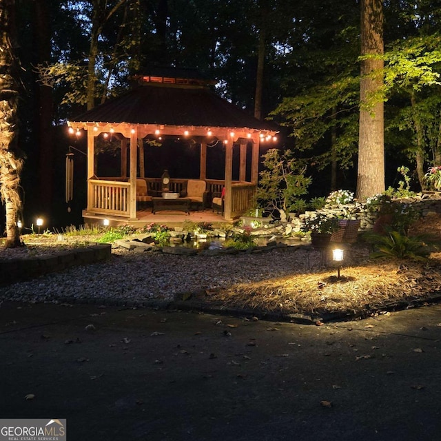 yard at night with a gazebo