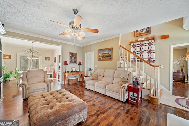 living room with stairway, a chandelier, wood finished floors, a ceiling fan, and ornamental molding