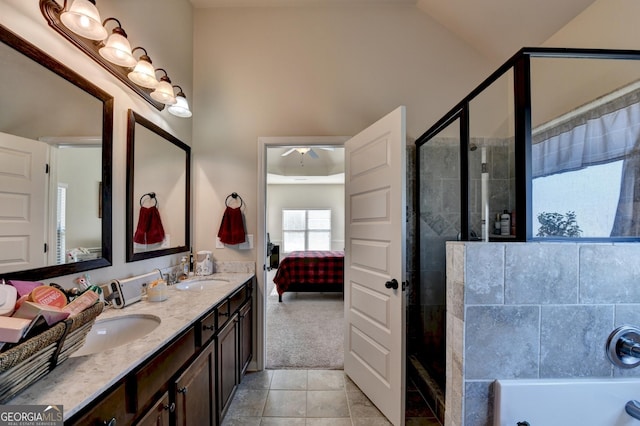 bathroom with vanity, tile patterned floors, vaulted ceiling, ceiling fan, and walk in shower