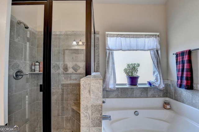 bathroom with shower with separate bathtub