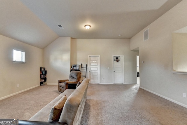 sitting room with light carpet and lofted ceiling