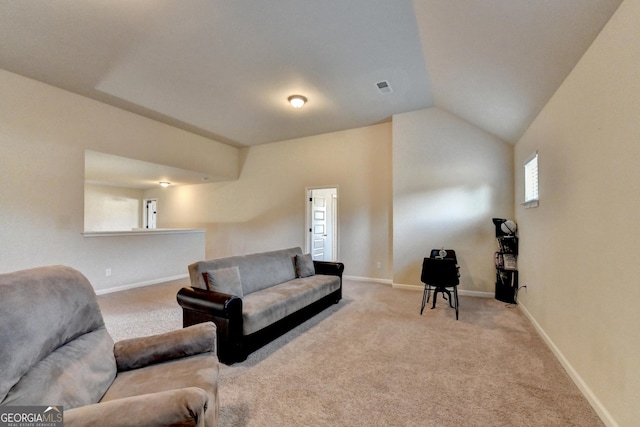 living room featuring light colored carpet and vaulted ceiling