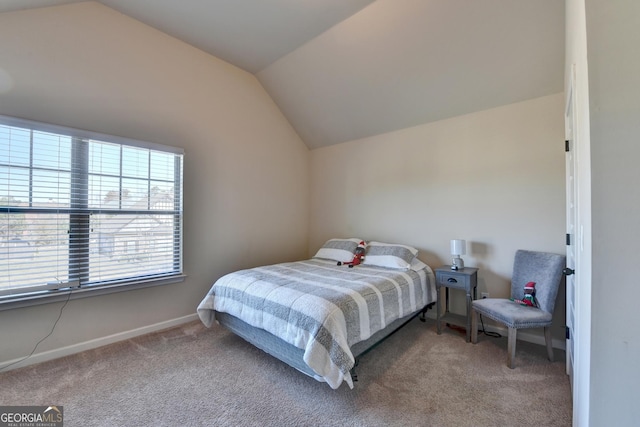 bedroom with carpet and vaulted ceiling