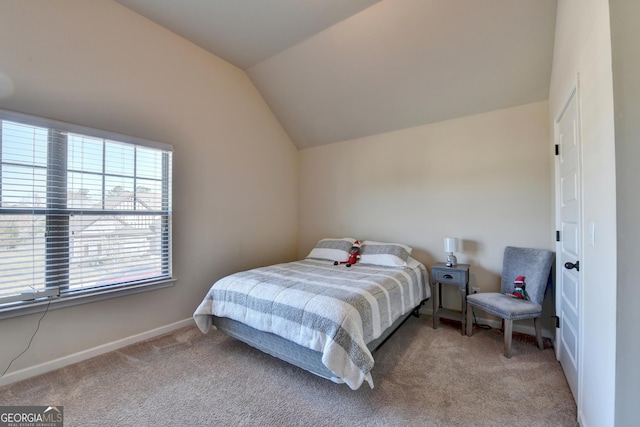 bedroom featuring carpet flooring and lofted ceiling