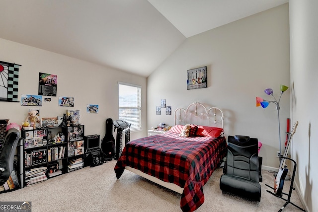 carpeted bedroom with vaulted ceiling