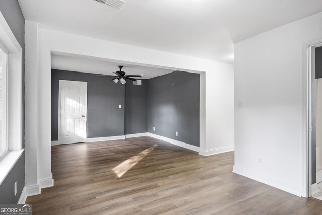 spare room with ceiling fan and light hardwood / wood-style floors