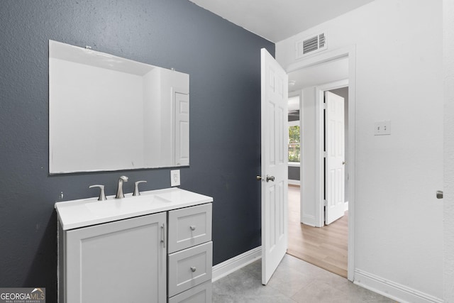 bathroom featuring tile patterned floors and vanity