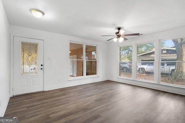 foyer entrance featuring dark hardwood / wood-style floors and ceiling fan