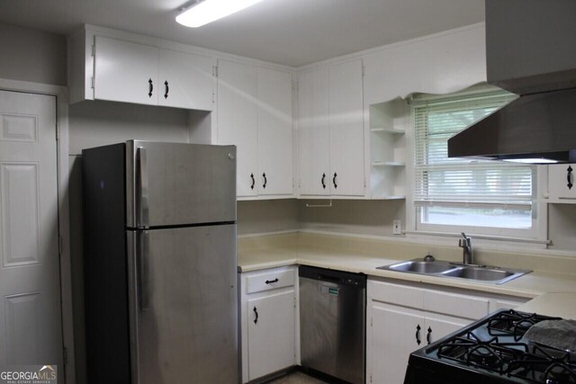 kitchen featuring sink, white cabinetry, stainless steel appliances, and extractor fan