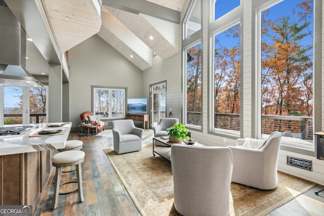 living room featuring high vaulted ceiling, wood ceiling, and hardwood / wood-style floors