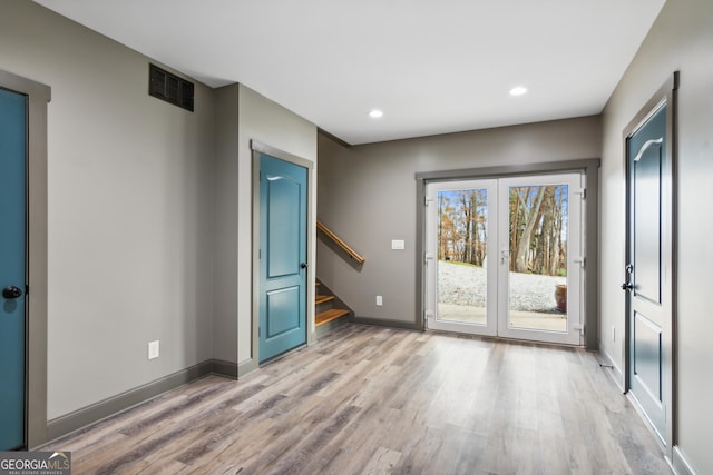 unfurnished room with light hardwood / wood-style flooring