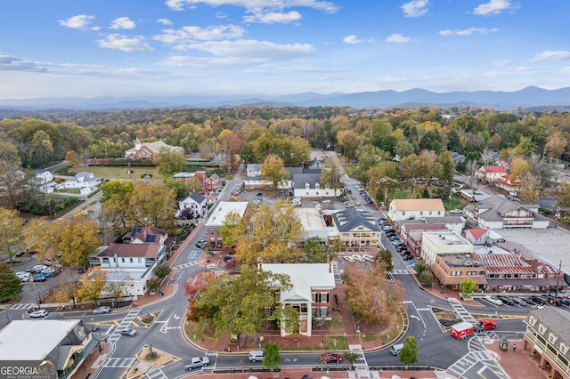 birds eye view of property featuring a mountain view