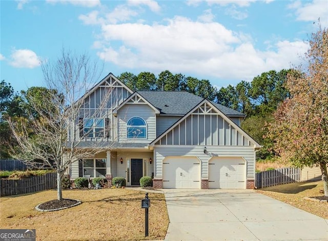 view of front of property with a garage and a front yard