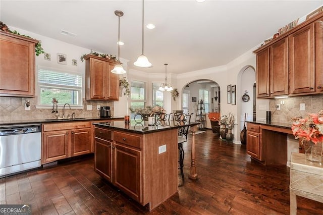 kitchen with dishwasher, a center island, a breakfast bar, dark wood-type flooring, and hanging light fixtures