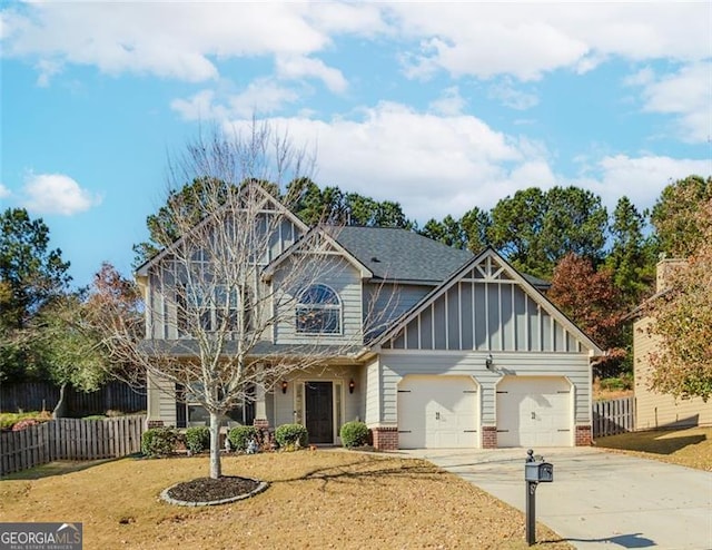 view of front facade featuring a front yard and a garage