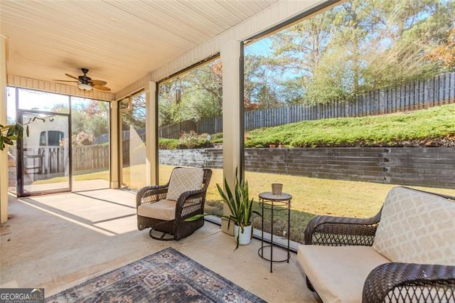 sunroom featuring ceiling fan