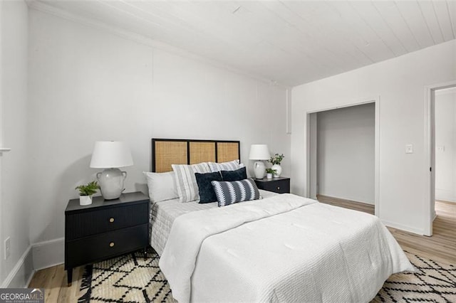 bedroom with light hardwood / wood-style flooring