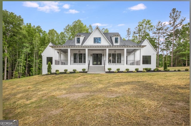 view of front of house featuring a front lawn and a porch