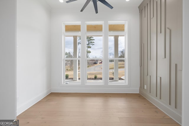 doorway to outside with ceiling fan, light wood-style flooring, and baseboards