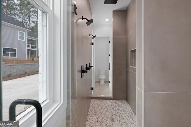 bathroom with toilet and speckled floor