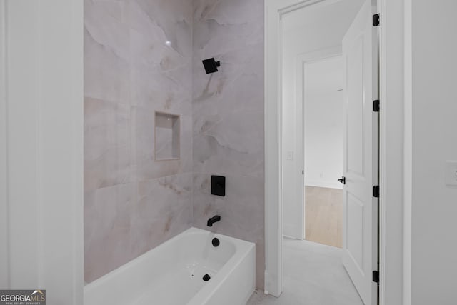 bathroom featuring washtub / shower combination