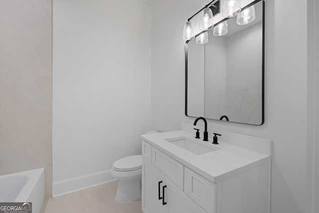 bathroom featuring baseboards, vanity, toilet, and a bath